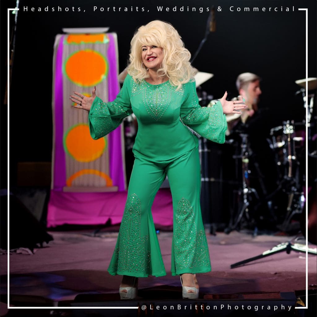 Dynamic full-body portrait of Definitely Dolly, embodying the spirit of Dolly Parton, shot in Leon Britton's professional studio