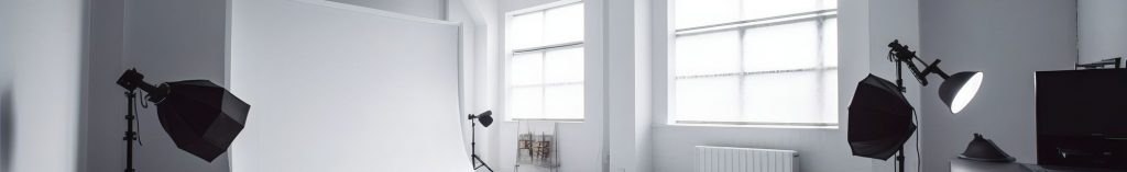 Empty photography studio with professional lighting equipment ready for individual headshots