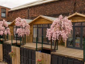 The Secret Warehouse Kirkdale exterior with cherry blossom trees