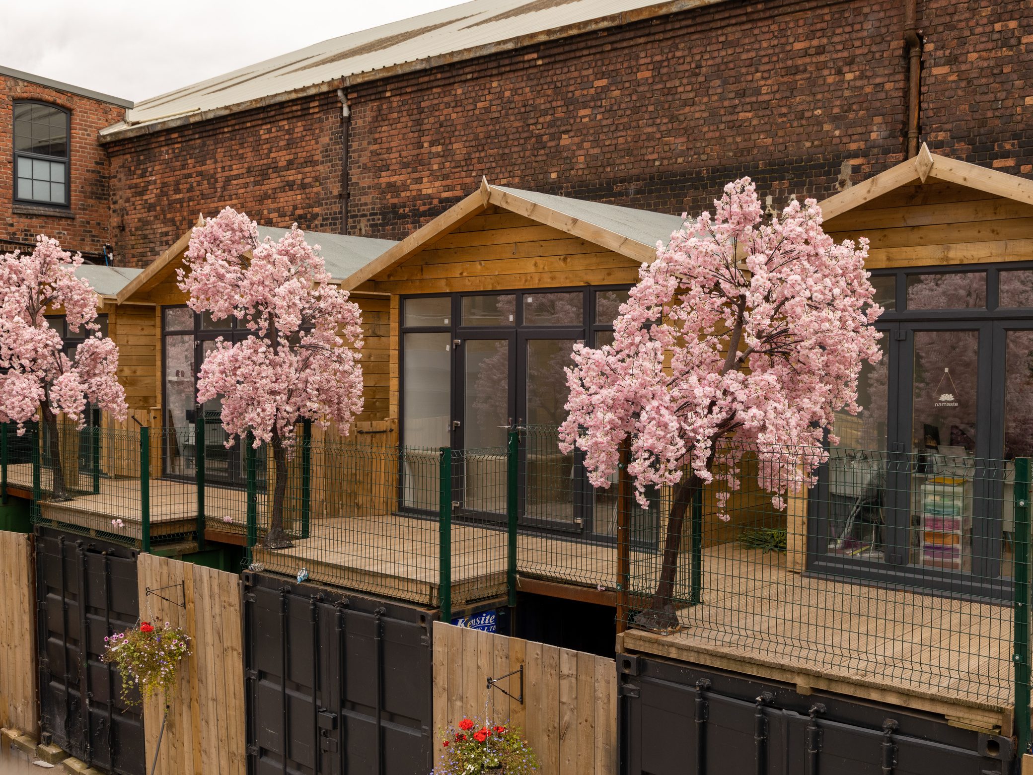 The Secret Warehouse Kirkdale exterior with cherry blossom trees