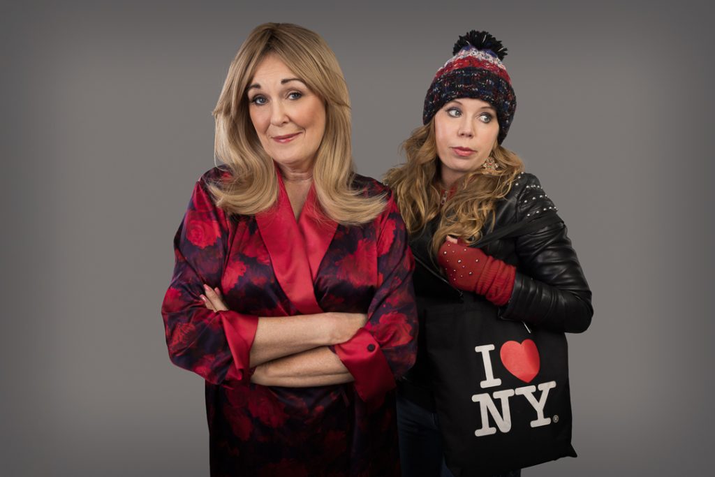 Two Slay Belles cast members in costume, promotional portrait