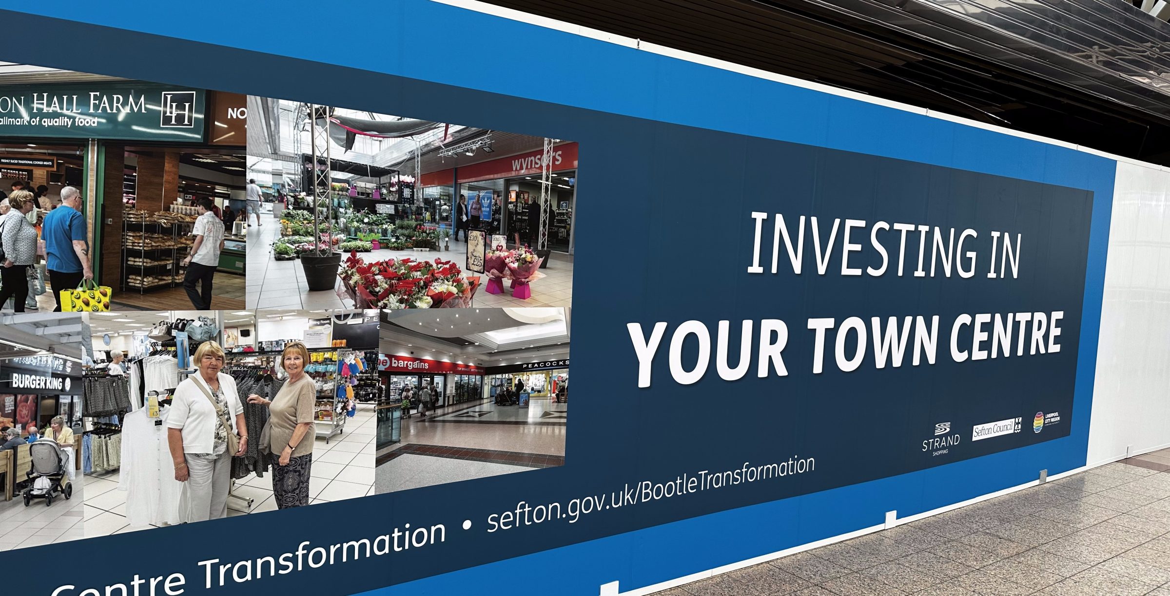 Leon Britton photography images displayed on hoardings during the New Strand Shopping Centre renovation in Bootle, commissioned by Sefton Council